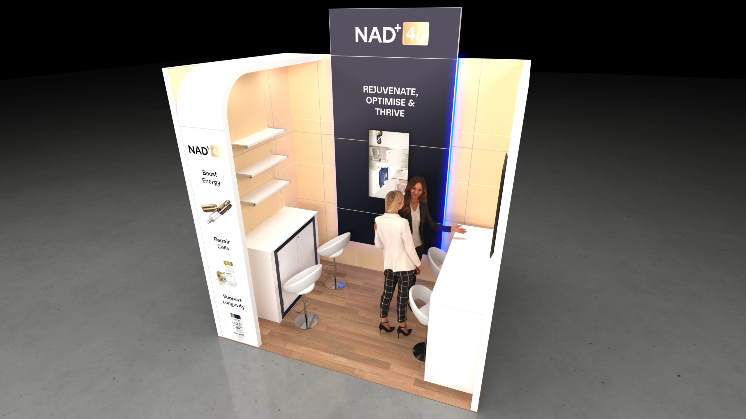 U-shaped exhibition stand featuring a central back wall with an elevated header panel. The left side has a vertical display column with product shelving, and the right side is an extended high-top counter/bar with two stools. Two people are interacting at the stand.