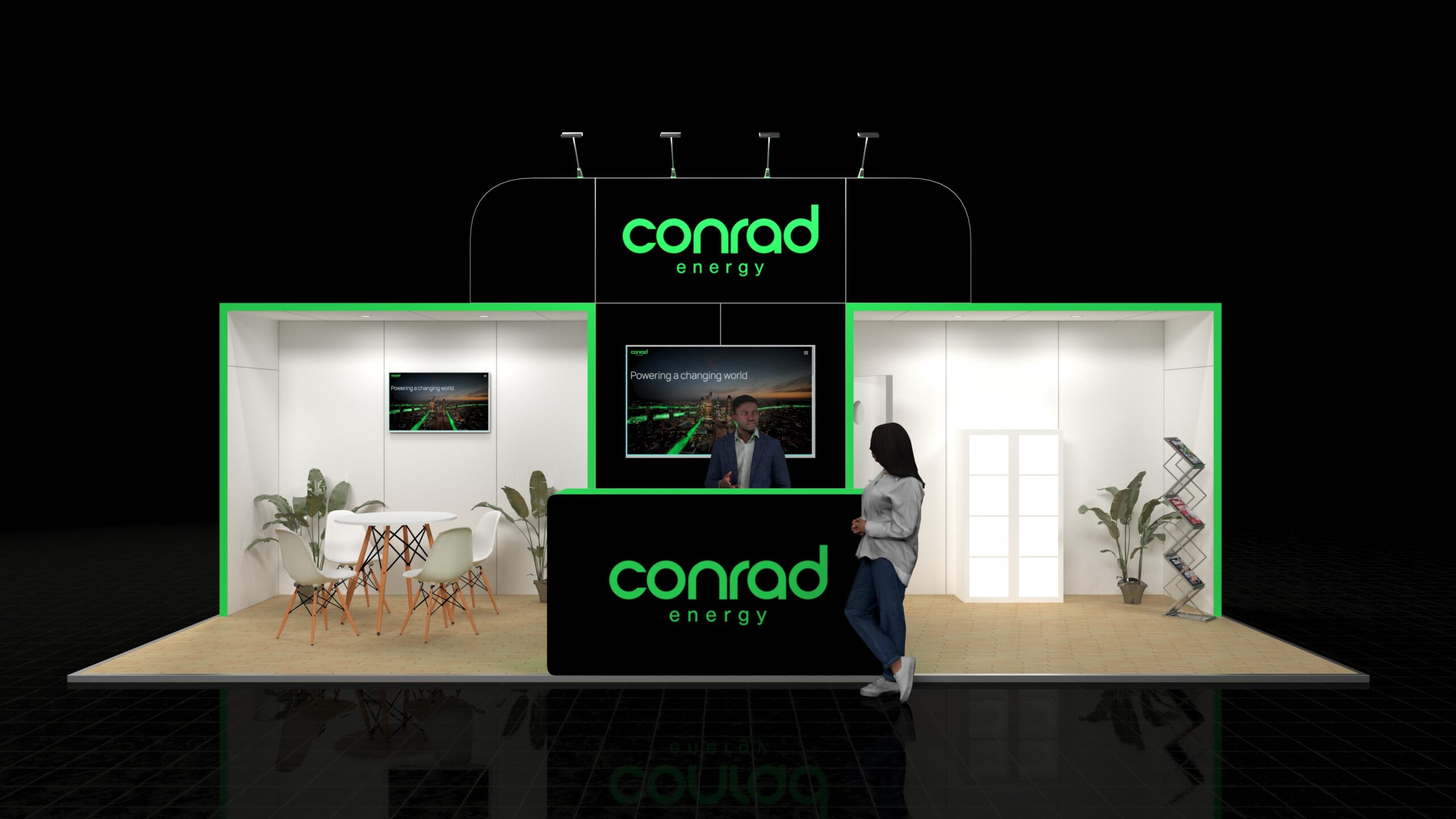 A large 8x3 metre exhibition stand. The stand features a central reception desk with a large screen above, a small meeting area with white furniture, and a brochure rack.