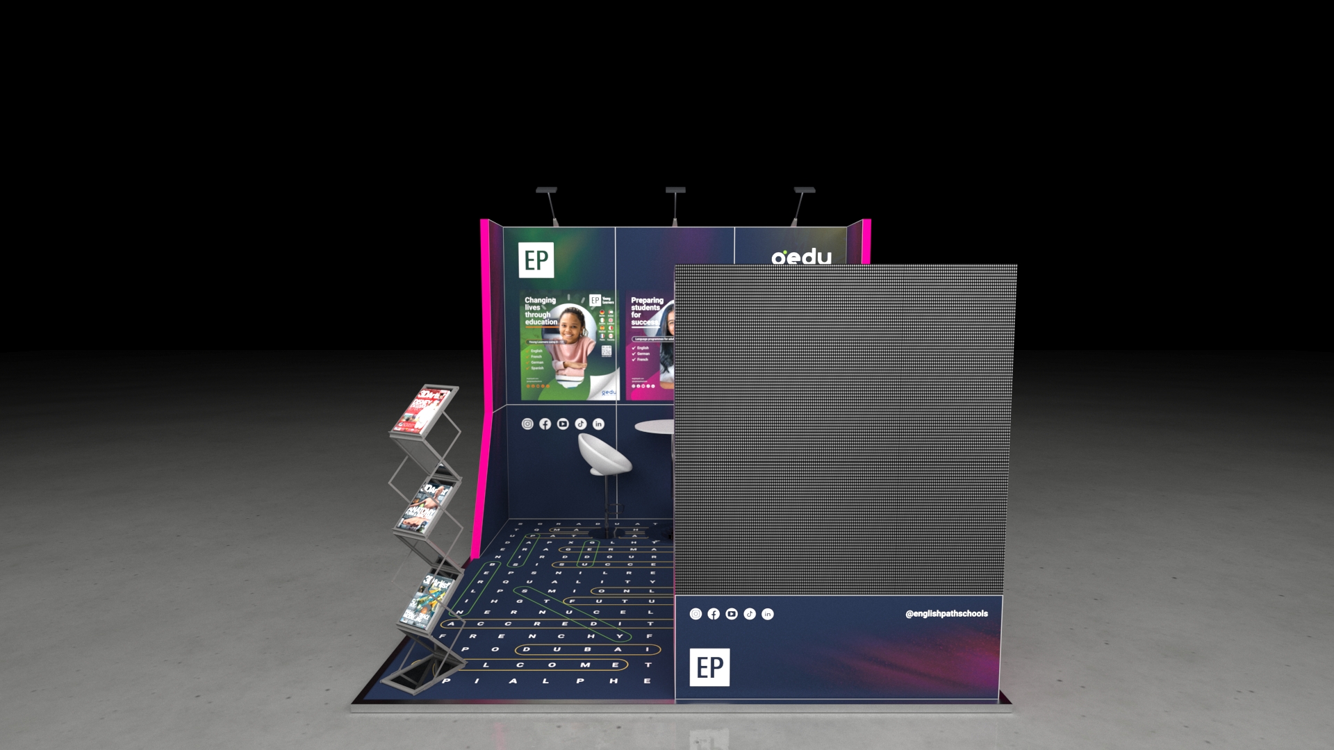 A 3x3 metre exhibition stand. The compact design features a back wall with large graphics, a small meeting area with a high table and white seating, and a tall, prominent display tower. The floor features an crossword themed graphic.