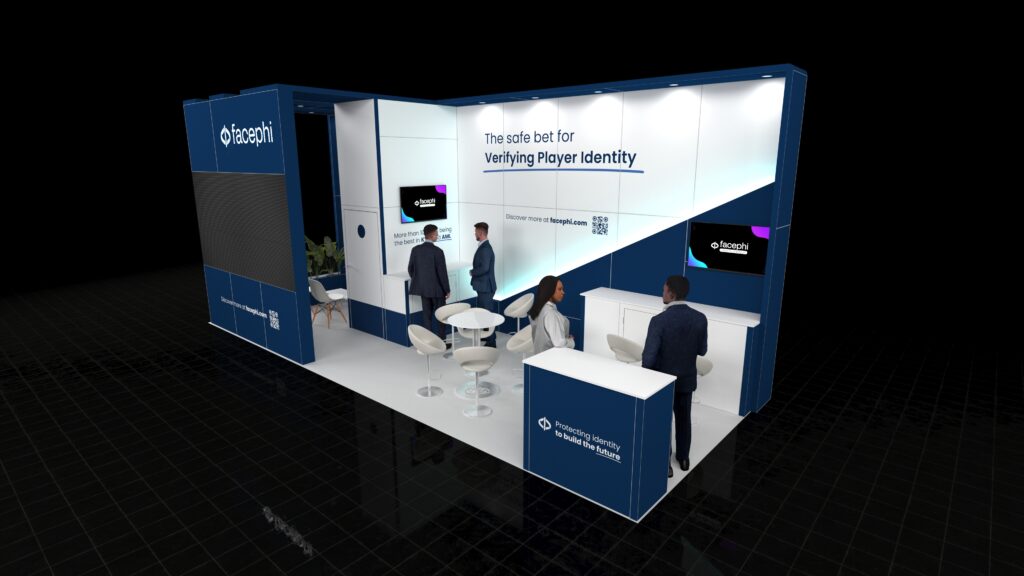 A 8x3 metre exhibition stand. The corner stand has a modern design with accent elements. Features include a large external LED video wall, a meeting area and a front reception counter. Digital screens are integrated into the interior walls.