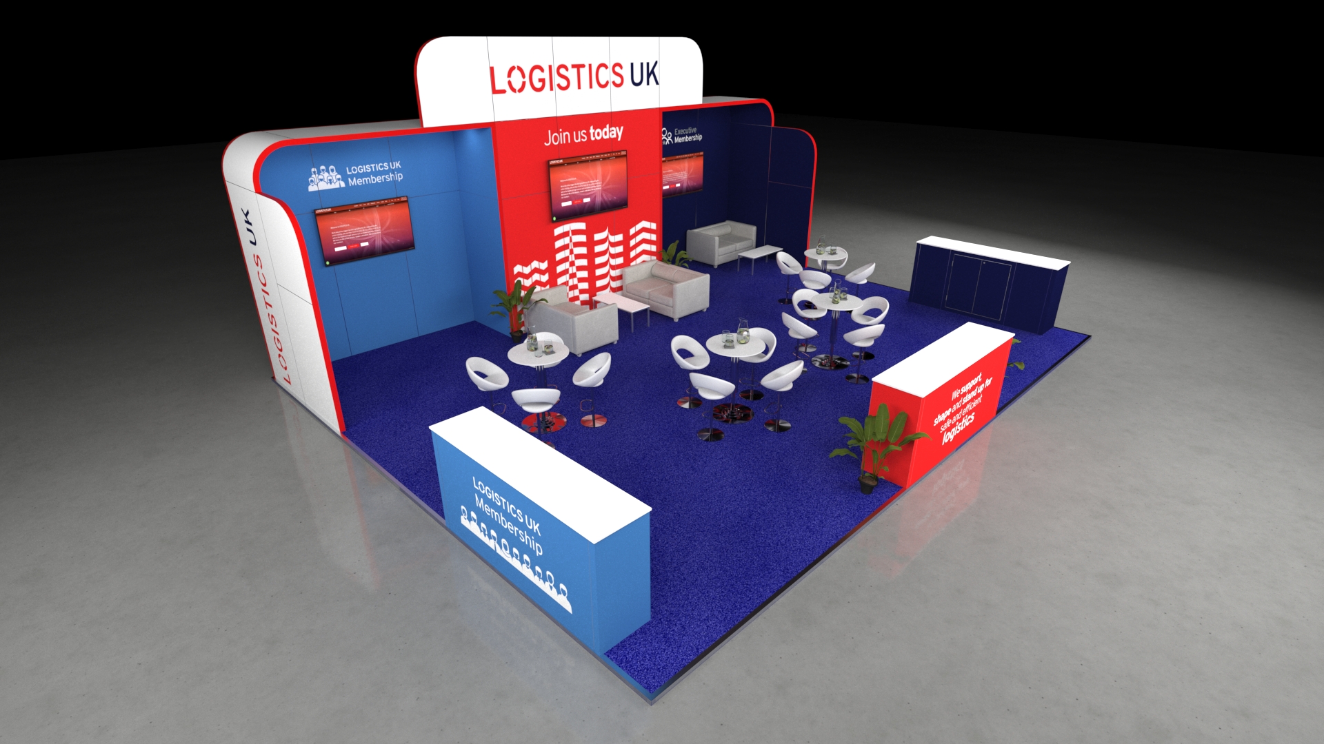 Large exhibition stand with high walls, multiple display screens, casual meeting tables, and perimeter reception counters.