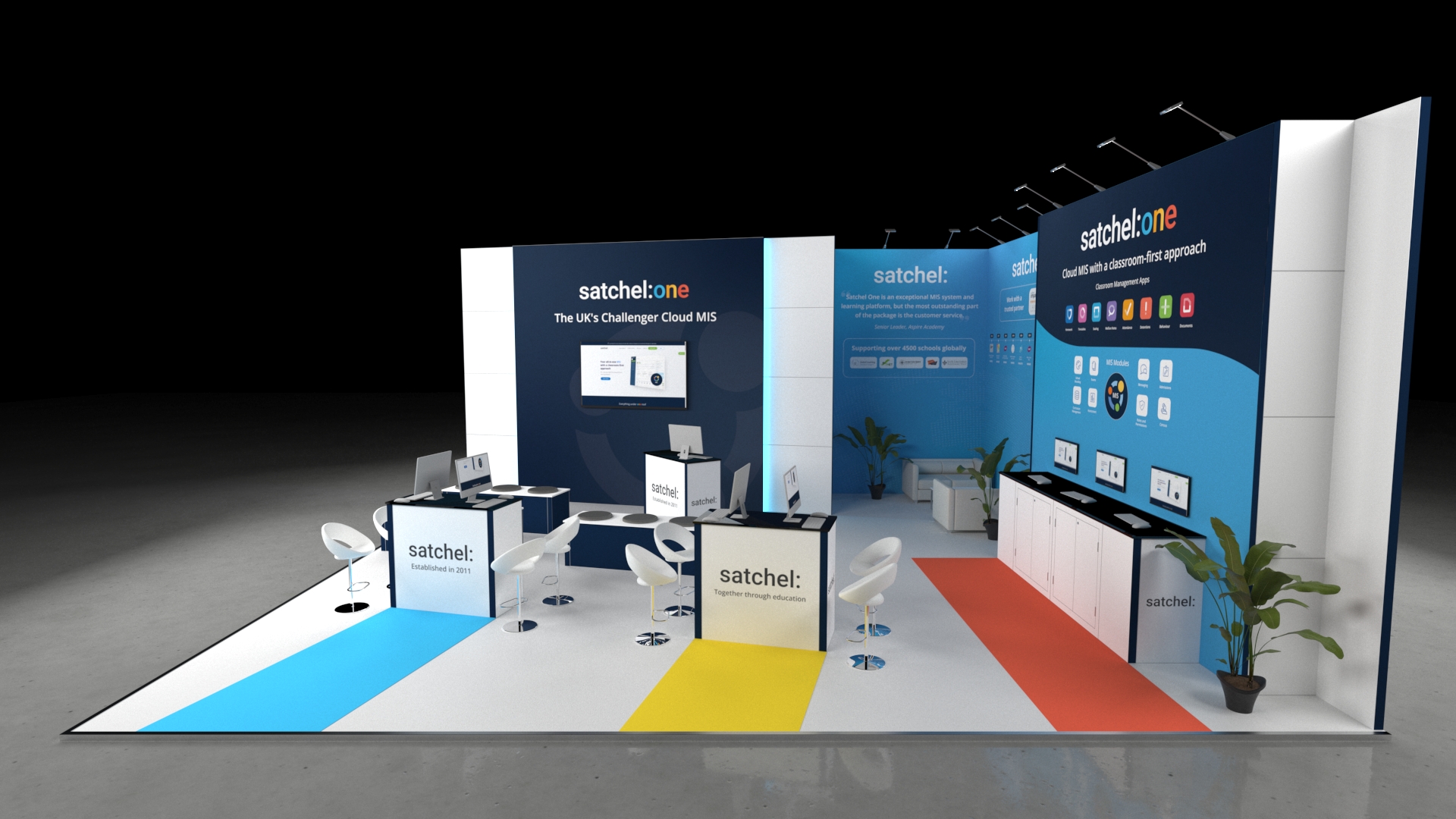 Modern exhibition stand with multiple counters, seating areas, digital screens, and informational wall displays in a clean, open layout designed for product demonstrations and visitor engagement