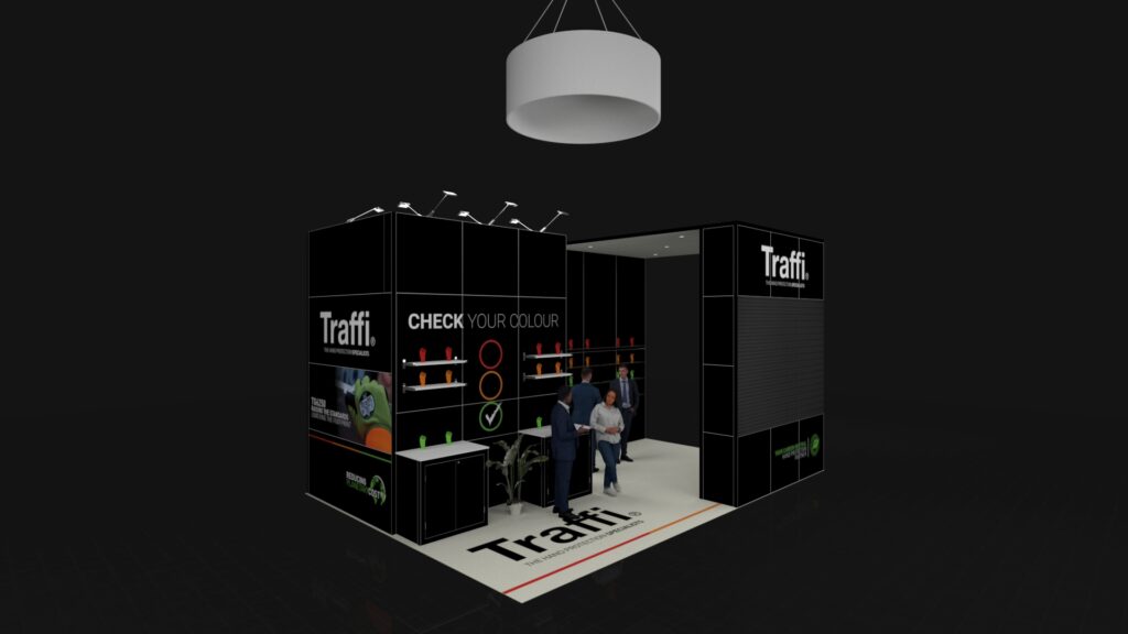 Modern exhibition stand with tall panels, glove displays, floor graphics, and a large circular hanging light above. Several people are interacting around the booth.