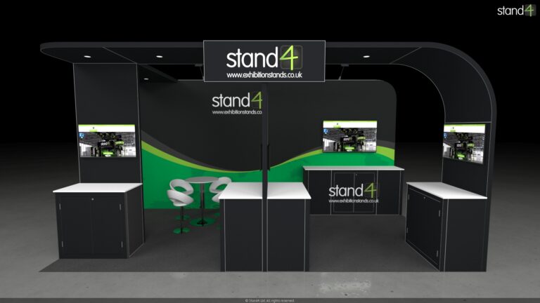 3D rendering of an open-plan exhibition stand featuring a large overhead canopy. The layout includes three front-facing presentation kiosks with digital screens and storage cabinets, a central meeting area with a high-top table and four bar stools, and a backwall equipped with overhead arm lights, a large monitor, and a long built-in counter.